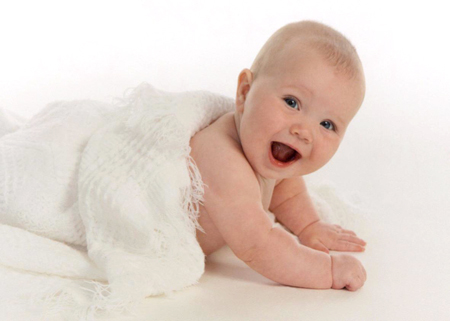 Smiling Baby Under Blanket