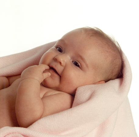 Baby Lying in Pink Fleece