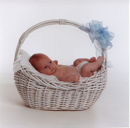 Baby in White Reed Basket