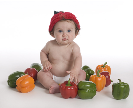 Baby in Knitted Pepper Hat