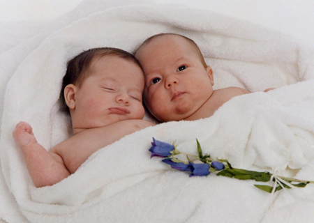 Two Babies and Flowers